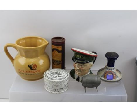 A SELECTION OF NOVELTY SPIRIT ACCESSORIES comprising; a Harrod's Carltonware "Doorman" jug, a Glenmorangie Single Highland Ma