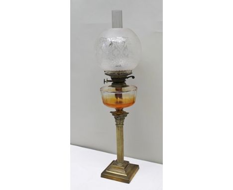 A LATE VICTORIAN BRASS CORINTHIAN COLUMN OIL LAMP with clear glass reservoir and decorative etched globe glass shade, brass c