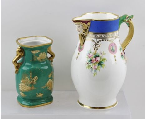 A FRENCH PORCELAIN JUG with moulded mask spout, cast serpent and mask handle, hand-painted floral decoration to the body, 22c