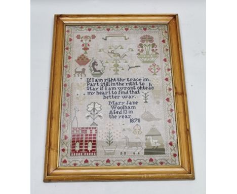 A 19TH CENTURY WOOLWORK NEEDLEWORK SAMPLER, the central text surrounded by beasts, tubs of plants and fruits, building etc., 