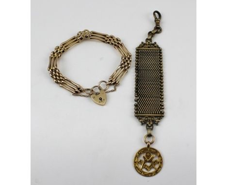 A 9CT GOLD GATE LINK BRACELET with padlock clasp, together with a 9ct gold Masonic fob, the fob is suspended from a yellow pl