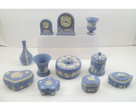 A COLLECTION OF WEDGWOOD CERAMIC ITEMS, includes lidded trinket boxes, vases and two clocks, pale blue ground with cameo appl