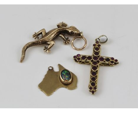 A 9CT GOLD CAST SALAMANDER PENDANT, a stone set 9ct. gold CROSS, and a 9ct. gold PENDANT shaped as Australia and set with an 