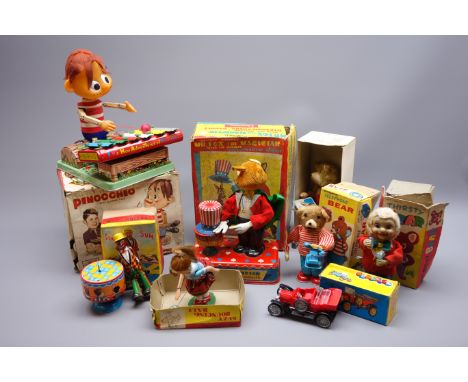 Eight 1960s Japanese clockwork/battery operated tin-plate toys comprising Pinocchio playing xylophone, Cragstan Mr. Fox The M