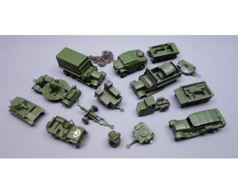 Dinky - nine unboxed and playworn early military vehicles including six-wheeled covered wagon, small tank with chain tracks a