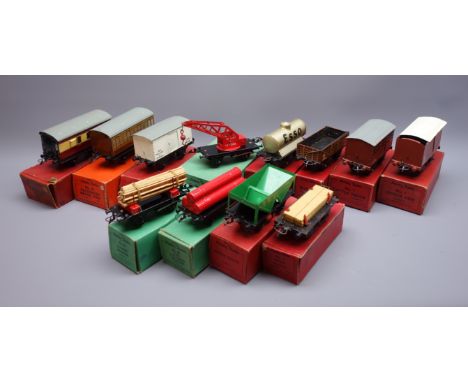 Hornby '0' gauge - twelve items of rolling stock comprising No.1 Cattle Truck, LMS Hopper Wagon, No.50 Gas Cylinder Wagon, No