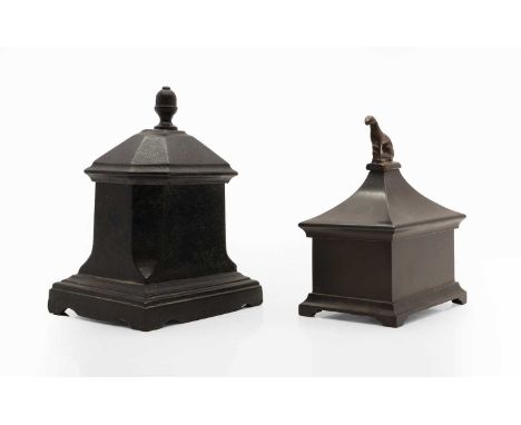 Two tobacco caskets,  19th century, one bronze surmounted with a hound, the other cast iron, with an acorn knop,  14.5 and 16