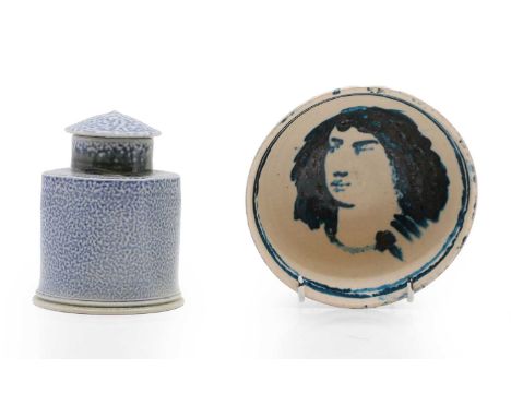 A small blue salt glazed pottery tea caddy, c.2007, of square to ciruclar form with circular cover, incised with crown to the