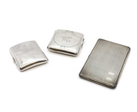 A group of three silver cigarette cases comprising an example with engine-turned decoration, Birmingham 1942, and two smaller