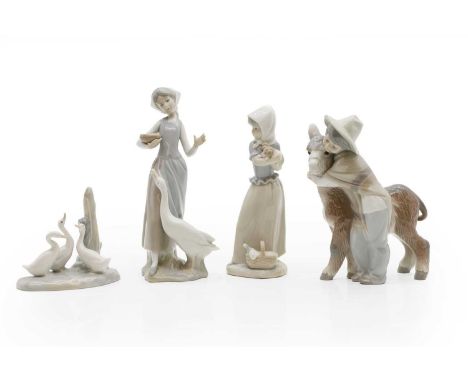 A group of Lladro and Nao porcelain figures of recent manufacutre, comprising ducks, two female figures, and a boy with a don