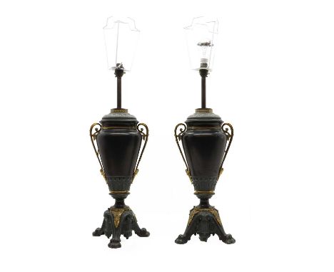 A pair of toleware and gilt metal table lamps, late 19th century, stamped R. Ditmar Wien, converted, each of twin-handled urn