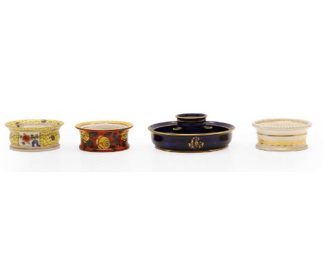 A Sèvres porcelain inkwell, in blue glaze with gilt borders, with printed marks, 17cm wide together with three further, compr