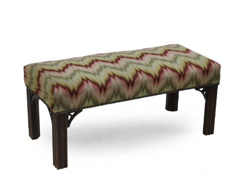 A Chippendale style mahogany stool, upholstered in bold geometric fabric on square section supports,75cm wide35cm deep33cm hi