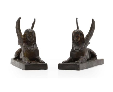 A pair of bronze winged Sphinx, 20th century, unsigned, 20cm long16cm highCondition ReportIn need of a clean. The edges are a