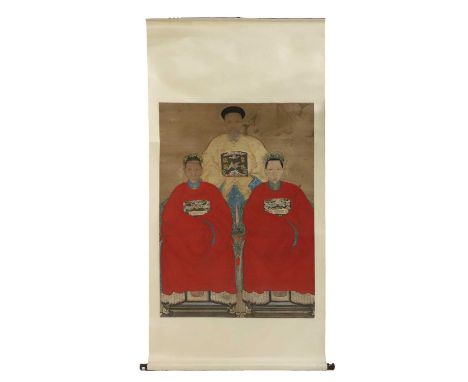 A Chinese hanging scroll, c.1900, of an ancestor painting with an official and two ladies seated wearing traditional court ro