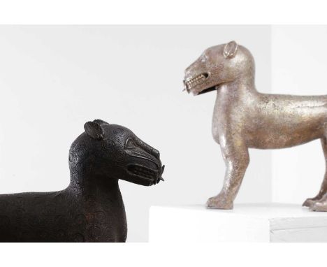 Two Benin-style bronze leopards, 20th century, each modelled in a standing position, one gilt and the other with a black lacq