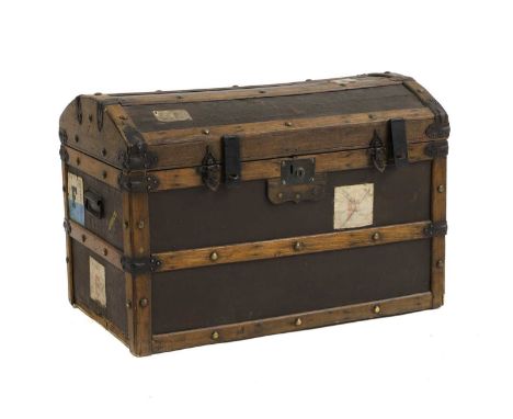 A domed top trunk, 19th century, with old labels, 84cm wide 50cm deep 58cm high approxCondition ReportWoirn. Used.