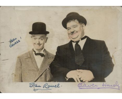 Stan Laurel signed photo and stamped Oliver Hardy 7x5 inch vintage black and white photo.&nbsp; Dedicated.&nbsp;Good conditio