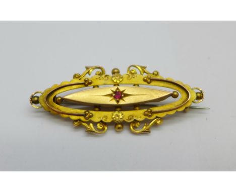 A 9ct gold and ruby brooch, 2.9g 