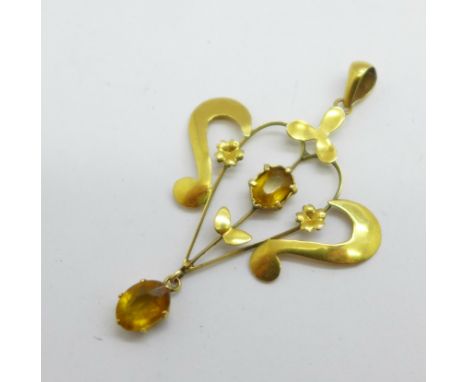 A 9ct gold and citrine set Art Nouveau pendant, 1.7g, width 31mm 