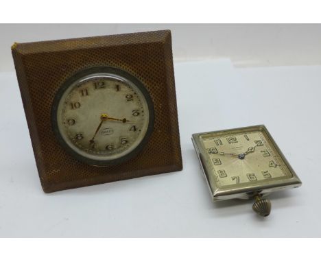 A C. Bucherer travel clock, no case, and an 8 Days travel clock 