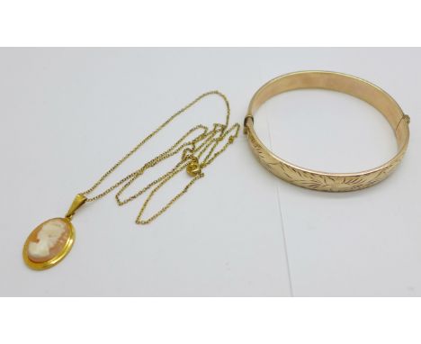 A 1/5 9ct rolled gold bangle and a cameo pendant and chain 