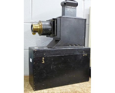 A circa 1895 magic lantern with wooden box, lacking condensing lens