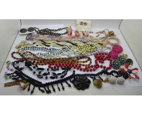 A carved jet brooch, necklace, other vintage necklaces including Czech, enamelled flower bracelet, earrings, etc. 
