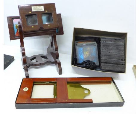 A mahogany lantern slide viewer, with slide carrier and a collection of slides, the viewer marked Adams &amp; Co., Makers, Lo