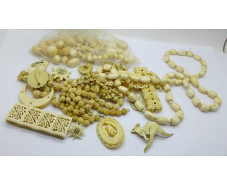 A collection of ivory, bone and carved jewellery, etc. 