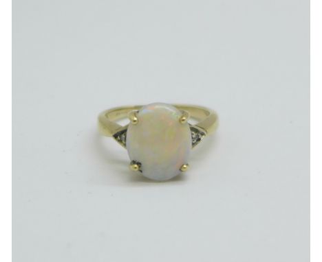 A 9ct gold and opal ring with diamond shoulders, 2.4g, L 