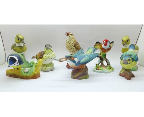 Eight bird figures; an Adderley goldfinch, four Crown Staffordshire by J. Bromley; Lapwing x2, Song Thrush and Blue Tit, one 