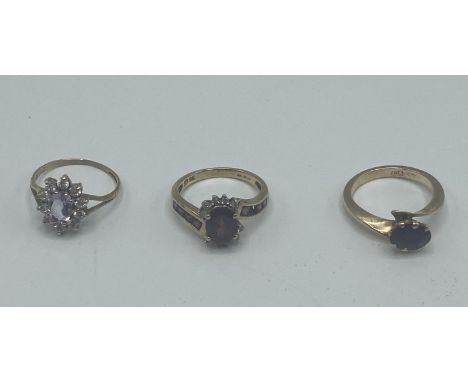 Three x 9 ct gold and gem set rings J-K-L 7.1 g 