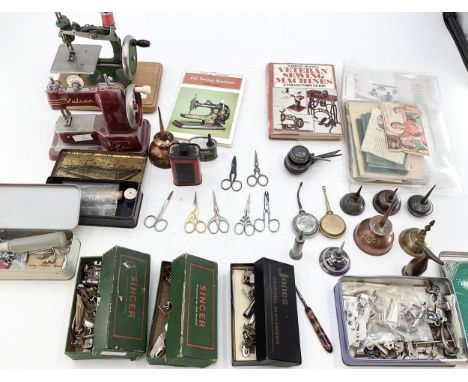 Two vintage miniature sewing machines, Vulcan Senior, Grain, together with sewing related tools, services equipment, manuals 