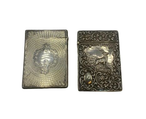 Two sterling silver card cases, one with a stag in a landscape, vacant cartouche, scrolling surround by Crisford &amp; Norris