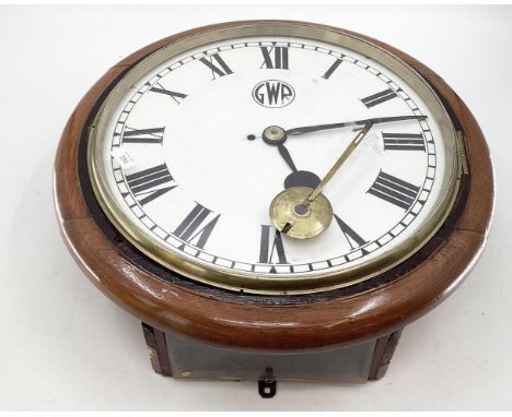 A large GWR circular station wall clock 57cm diaUnsure if it works. Chain on movement is intact, movement looks clean and wel