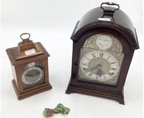 Mahogany bracket clock, Arched face with silvered dial and gilt spandrels, retailed by Liberty of London, plaque verso, and a