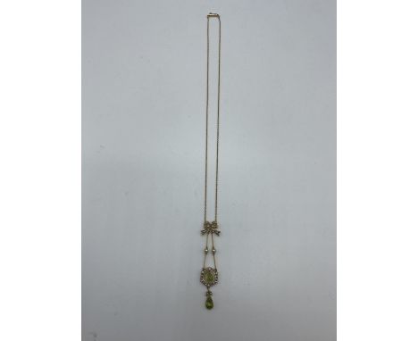 A 9 ct gold chain link necklace with peridot And seed pearl pendant 5.07 g 