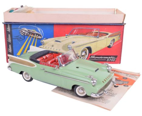 Schuco Synchromatic 5700  Packard Tinplate Car, light green body, cream/gold plastic fins, red tin printed seating, front whe