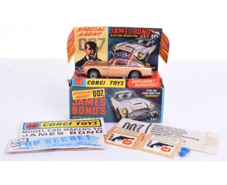 Corgi Toys 261 James Bond Aston Martin from the Film “Goldfinger” gold body, with ejector seat, rear bullet screen, retractab