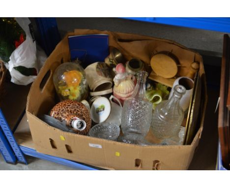 A box containing various glass and china including decanters and stoppers; brass embossed plaques; pottery table lamp etc