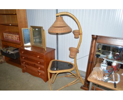 A cane and glass topped lamp table