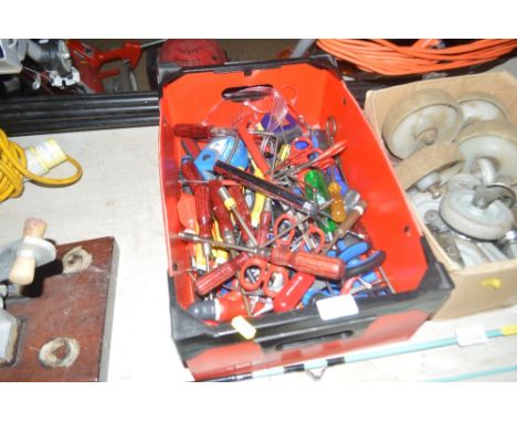 A box of various hand tools
