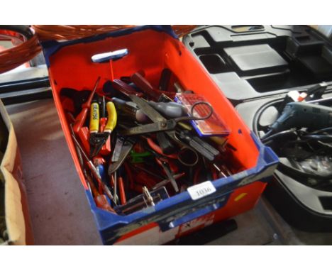 A box of various hand tools