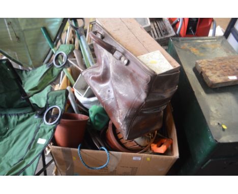 A box of various gardening tools and planters 