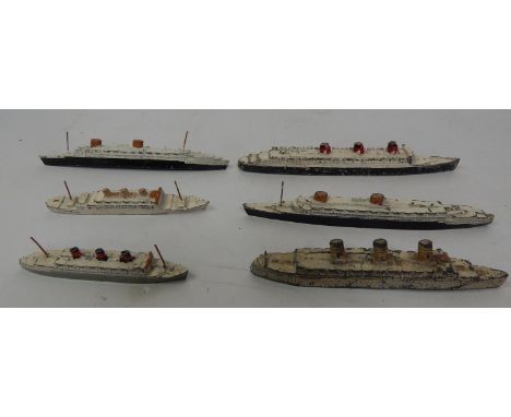 Six Meccano Dinky Toys die cast model steam ships, including Queen Mary, Europa (x2), Empress of Britain, Queen of Bermuda, e