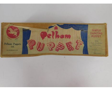 A Pelham Puppet, of a girl in dress, in original box, (AF).