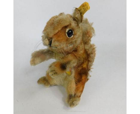 A Steiff original squirrel, with original Steiff label to ear, No.2040422, with cardboard market label named Perri, 20cm high