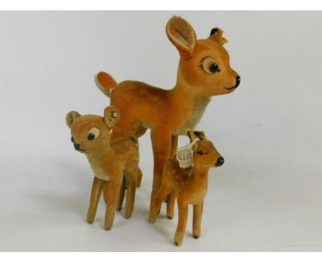 Three mid 20thC Steiff deer figures, to include a small Steiff Bambi, No.41200, with cotton label to ear, 10cm high, and an a