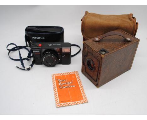 A vintage Olympus Quick Flash AFL camera with case along with a Box Ensign camera with case and instructions